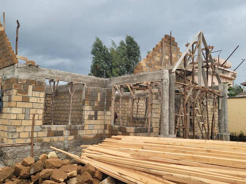 Timber roof trusses erected over the completed walling
