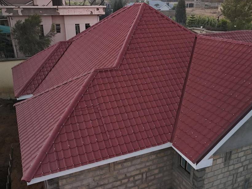 Aerial view of the completed stone-coated tile roof