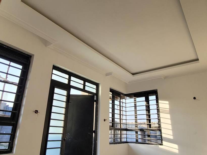 Finished interior with gypsum ceiling and steel windows